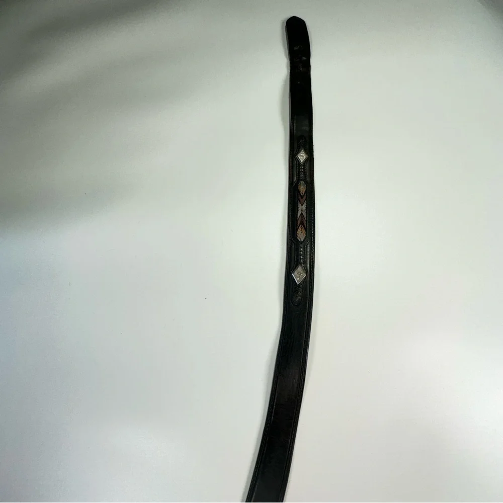 Black Leather Belt with Intricate Silver Buckle